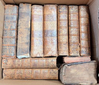 a box full of old books sitting on a table