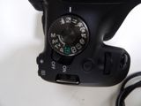 a close up view of a digital camera with a cord
