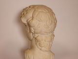 marble bust of a woman with flowers on her head