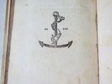 an open book with a drawing of an anchor on it