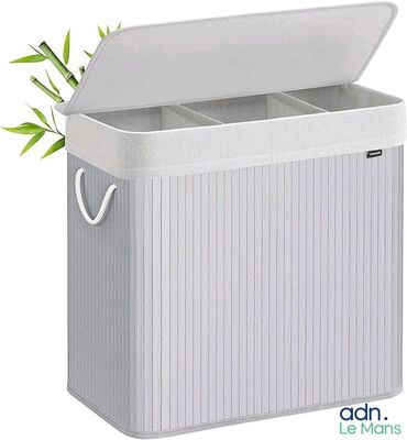 a close up of a white trash can with a plant in it