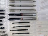 many different types of screws in a plastic box