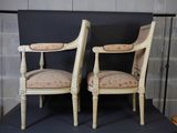 two chairs that are sitting next to each other