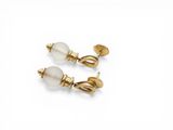 a pair of pearl and gold earrings
