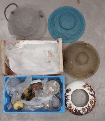 a blue box filled with assorted items sitting on the floor