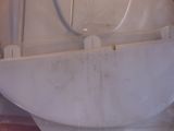 a white boat in a plastic bag on a table
