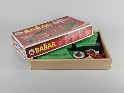 a box with a toy car inside of it on a table