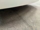 a car that is parked on the street in the parking lot