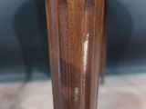an image of a close up of a wooden table with a glass top