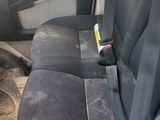 a seat in the back of a van with a seat belt