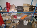 many boxes and boxes on the shelves in the room