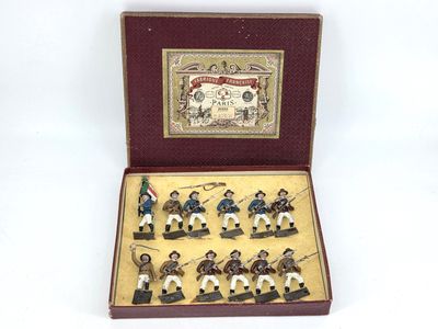 figurines of men dressed in uniforms in a wooden box