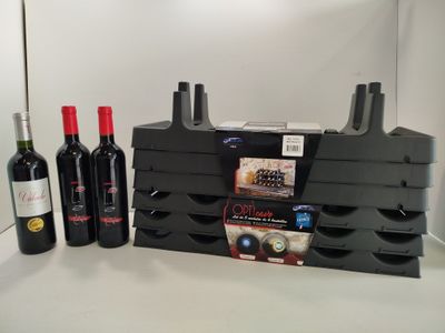 three bottles of wine and two bottles of wine on the counter