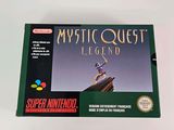 the box for the game mystic quest legend is sitting on a white surface