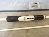 a fishing rod and a fishing pole laying on the ground