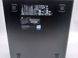 the back of a laptop with a battery attached to it