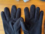 a pair of gloves, a hat, and a pair of gloves on a table