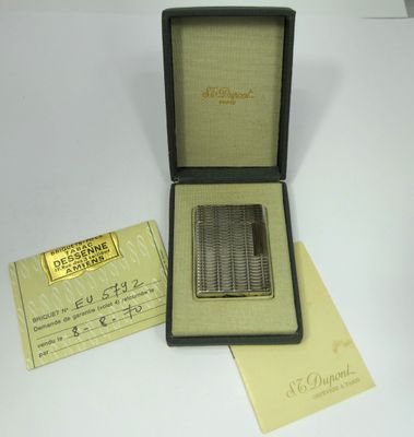 an image of a box with a silver plated cigarette in it
