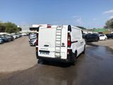 a white van that is parked in a parking lot