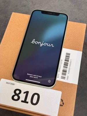 an iphone is sitting on top of a box with a barcode on it