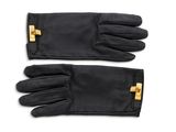 une paire de gants en cuir noir avec des boucles dorées