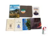 many books that are sitting on a white surface