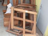 many pieces of wood stacked on top of each other in a garage