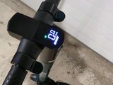 a close up of a bicycle with a clock on the handlebar