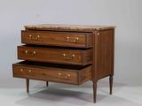 a small chest of drawers with three drawers on it