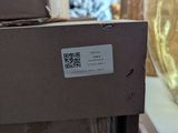 a picture of a glass vase with a qr code on it