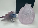 two vases that are sitting next to each other on a table