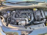 a picture of a car engine with its hood open