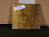 a piece of wood with a piece of paper on top of it
