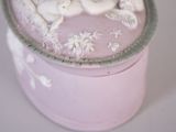 a small pink box with a picture of two cats on it