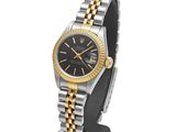 a lady ' s rolex watch with a black dial and two - tone bracelet