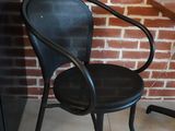 a black chair and a black table in a room