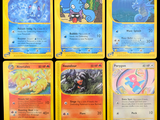 several pokemon cards are displayed on a black background with a yellow border