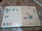 a book with stamps on it sitting on a table