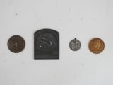 four different types of coins are shown on a white surface