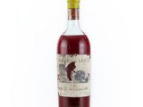 a bottle of liquor sitting on top of a white surface