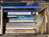 many books in a box on the table