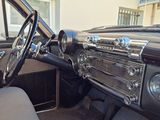 a dashboard and steering wheel of a classic car