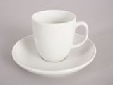a white cup and saucer sitting on a saucer