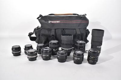 the camera bag is full of many different lenses and lenses