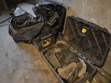 two suitcases that have been left on the floor