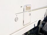 an image of a white trailer parked on the side of the road