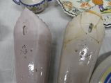 two vases sitting on a table next to each other