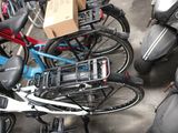 many bikes parked next to each other in a parking lot