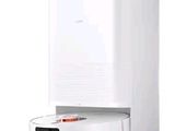 une image représentant un aspirateur blanc et noir