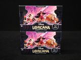 Deux boîtes de Lorcana sont posées sur une surface noire.